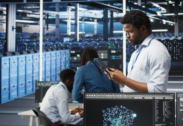 data-center-engineer-using-tablet-interpret-ai-generated-data-analytics-graphs data-center-engineer-using-tablet-interpret-ai-generated-data-analytics-graphs