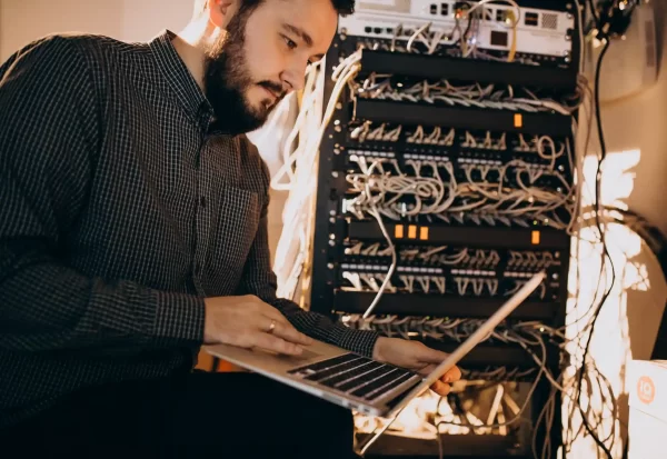 young-it-service-man-repairing-computer